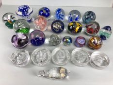 Glass paperweights, a collection of Decorative coloured glass paperweights and commemorative