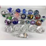 Glass paperweights, a collection of Decorative coloured glass paperweights and commemorative