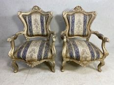 Pair of Louis XV style armchairs, with cartouche-shaped backs, on cabriole legs terminating in