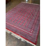 Large Red Ground Bokara hand woven rug approx 3.3 x 2.2m