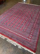 Large Red Ground Bokara hand woven rug approx 3.3 x 2.2m