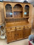 Pine kitchen dresser with three drawers and cupboards under, glass shelves above approx 131cm x 45cm