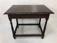 Oak console table with turned legs and carved frieze design