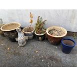 Collection of garden pots and a statue