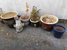 Collection of garden pots and a statue