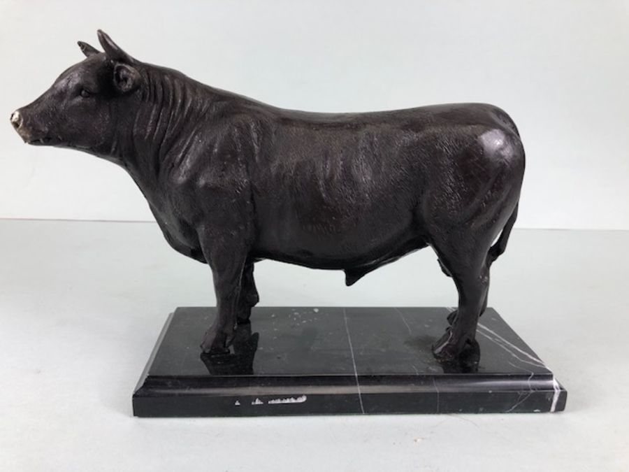 Bull statue, Metal figure of a bull on a marble base approximately 17cm high
