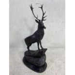 Statue of a Stag, large metal statue of a stag stood on rocks mounted on a marbel base with
