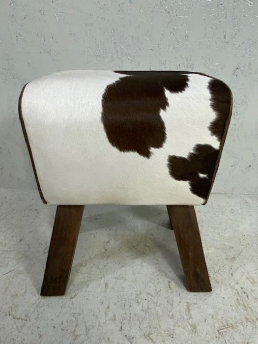 Contemporary faux cowhide footstool, approx in 52cm in height