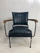 Contemporary metal framed chair with petrol blue upholstery and wooden arm rests, approx height at