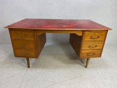 Mid 20th Century Desk, Light teak kneehole desk with 5 draws one being a double file draw, faded red