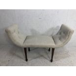 Sheraton revival window seat with tapering legs and spayed feet with light coloured upholtery and