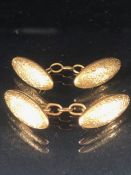 Pair of 15ct 625 Gold marked oval cufflinks with engraved floral swags total weight approx 4.9g