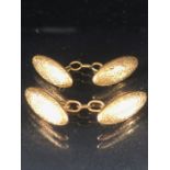 Pair of 15ct 625 Gold marked oval cufflinks with engraved floral swags total weight approx 4.9g