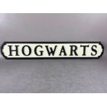 Modern wooden sign, Harry Potter interest, 'HOGWARTS', in the form of a cast iron road sign,