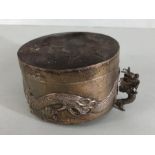A Silver Chinese lidded pot with raised dragon decoration underside stamped 'WH' 90 with character