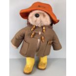 1970s Gabrielle Designs Paddington Bear with yellow Dunlop wellington boots, duffle coat and