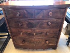 Mahogony bow fronted chest of five drawers with turned handles on bun feet