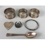 Collection of hallmarked silver items to include Christening bracelet three napkin rings a