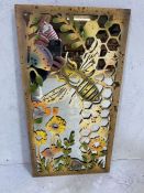 Decorative interest, Modern mirror with metal cut out bee and honeycomb design.