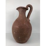 Terracotta jug, large unglazed terracotta jug in the style of a Greco Roman wine pitcher