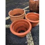 Three terracotta garden plant pots