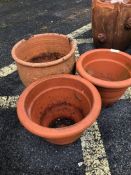 Three terracotta garden plant pots
