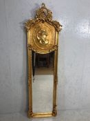 Large gilt framed Mirror, the frame with a classical head and foliage design in the Rococo style,