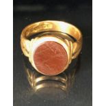 15ct Gold double banded ring set with a deep red carnelian (surface scratches) approx size 'O' &