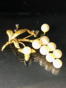 Marked 14k Gold Brooch set with cultured pearls and Sapphires in a floral spray design