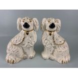 Royal Doulton, A pair of Victorian style King Charles mantelpiece dogs the bottoms marked Royal