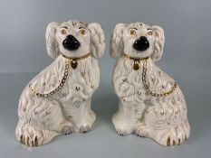 Royal Doulton, A pair of Victorian style King Charles mantelpiece dogs the bottoms marked Royal