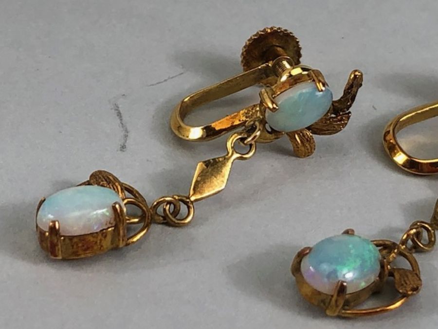 Pair of 14ct Gold drop earrings each set with two cushion cut Opals (total drop approx 32mm) - Image 7 of 13