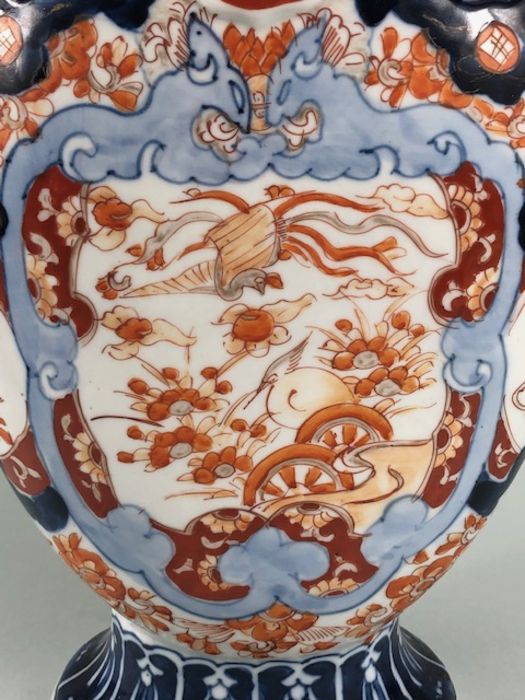 Japanese Imari ware, 2 Imari vases (a pair) painted with designs of Ho Ho birds and symbols of - Image 4 of 16