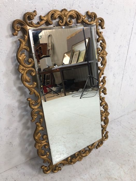 Gilt Frame Mirror, bevelled glass mirror in a rococo style gilt frame approximately 83 x 50 cm