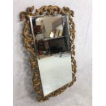 Gilt Frame Mirror, bevelled glass mirror in a rococo style gilt frame approximately 83 x 50 cm