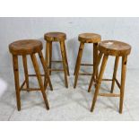 Wooden bar stools, 4 pine bar stools on tapered legs with round dished seats approximately 68cm