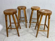 Wooden bar stools, 4 pine bar stools on tapered legs with round dished seats approximately 68cm