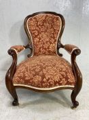 Upholstered nursing chair, large in size, on castors, with button back (A/F)