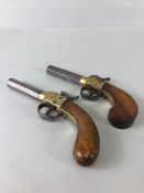 Antique pistols, two 19th century Box lock percussion pistols, both with engraved brass box frames