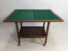Card Table, 20th century folding card table on casters approximately 65 x 43 x 69cm when folded.
