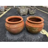Pair of circular terracotta garden pots, approx 27cm tall