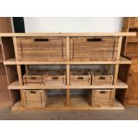 Modern light wood shelf unit with 7 wicker baskets for storage, approximately 185cm x 38cm x 123 cm