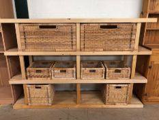 Modern light wood shelf unit with 7 wicker baskets for storage, approximately 185cm x 38cm x 123 cm