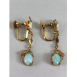 Pair of 14ct Gold drop earrings each set with two cushion cut Opals (total drop approx 32mm)