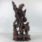 Oriental Carving, Chinese hard wood carving of fisherman with a child, both with inlaid eyes,