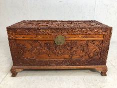 Camphor wood chest, Chinese Camphor wood chest deeply carved with scenes of warriors in battle, on