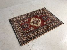 Wool rug, Modern Kazac wool rug with geometric designs approximately 124cm x 86 cm