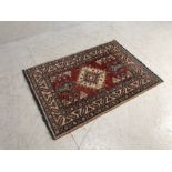 Wool rug, Modern Kazac wool rug with geometric designs approximately 124cm x 86 cm