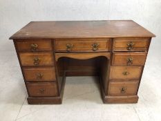 Kneehole desk with nine drawers, approx 121cm x 54cm x 80cm tall