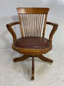 Oak slat back captains chair with padded seat, stud detailing, on castors